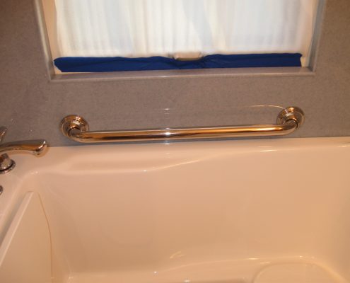 Holm walk in tub with horizontal safety bar