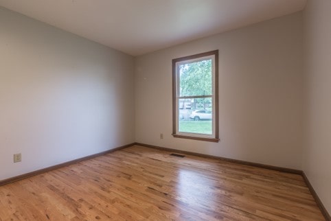 Bedroom with one window and new floors
