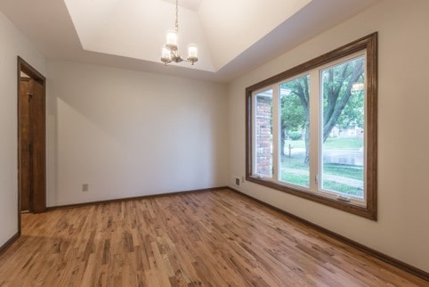 Formal living room with recessed or tray ceiling