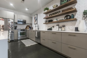 Kitchen condo style with white subway tile and floating shelving