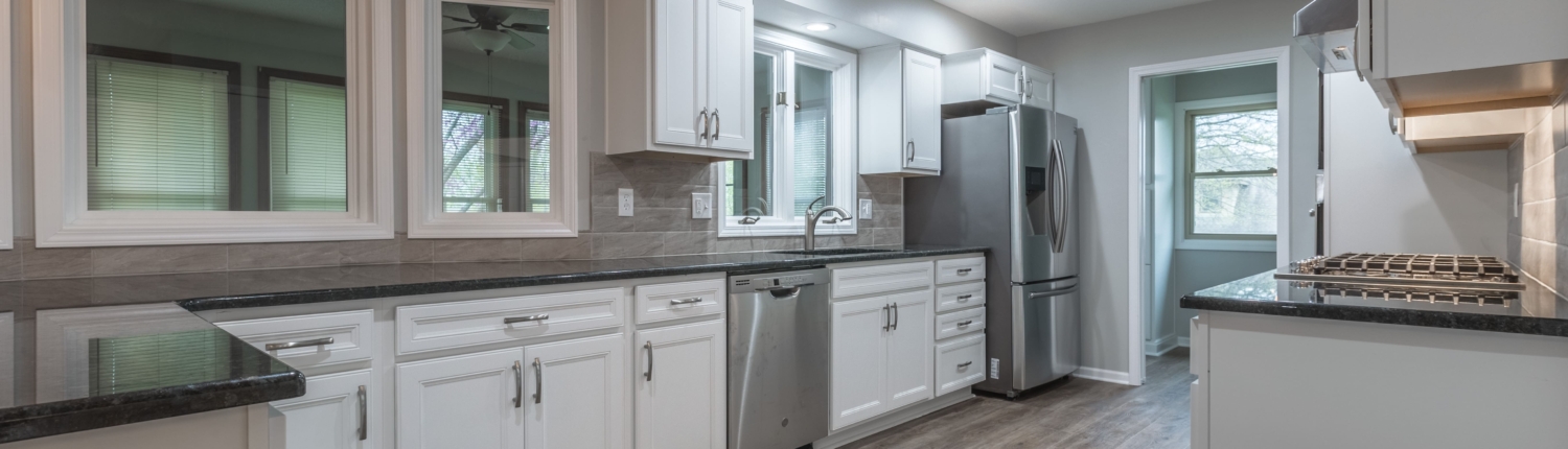 Open kitchen design with grey walls