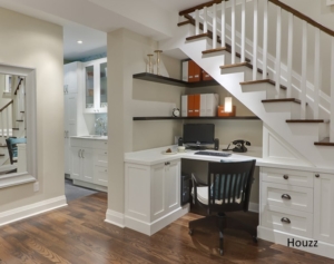 Built in desk under stairs with build in cabinets and shelving as shown on Houzz.