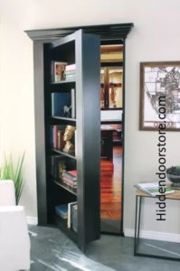 A hidden office space behind a bookcase in wall from hiddendoorstore.com