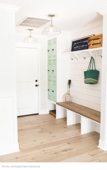 Mudroom with seating, coat racks and lockers